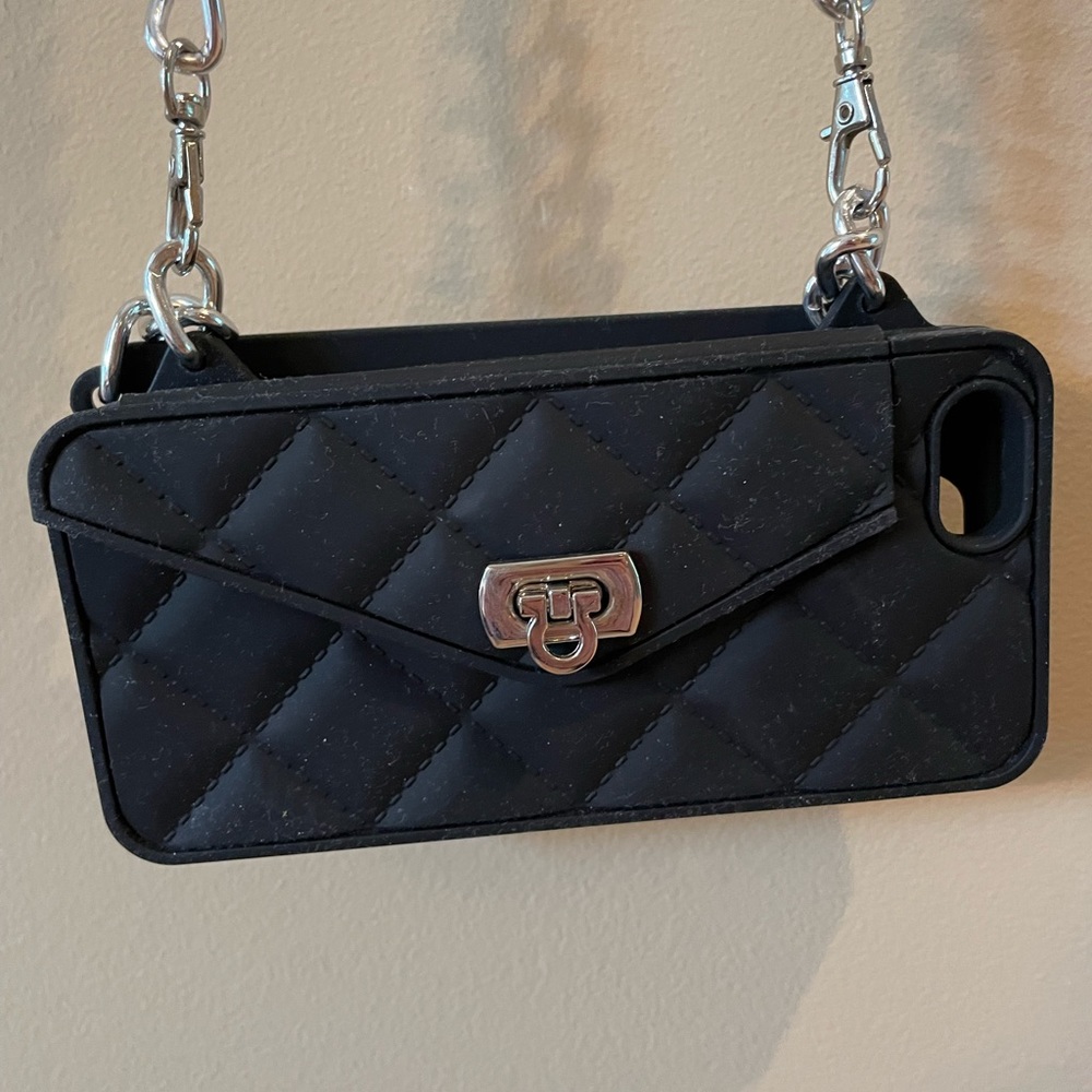 Crossbody cellphone case with mini pocket.